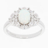 Elegant oval opal ring with sparkling white gemstones in sterling silver setting.